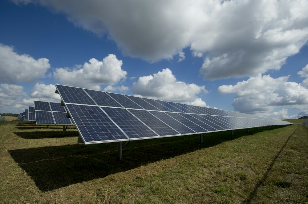 Solar panels in a green field